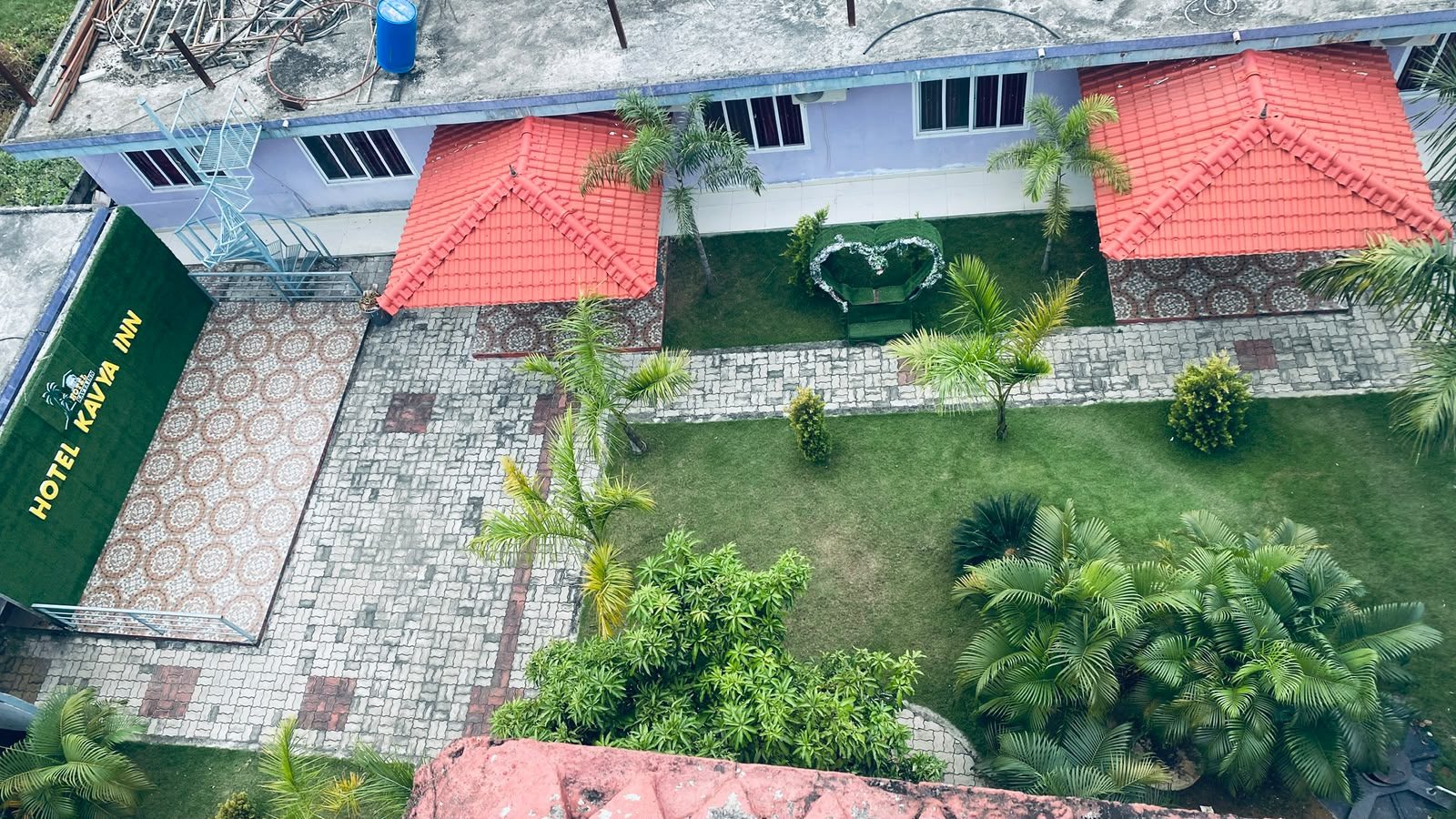 Aerial view of Hotel Kavya Inn garden with wedding arch