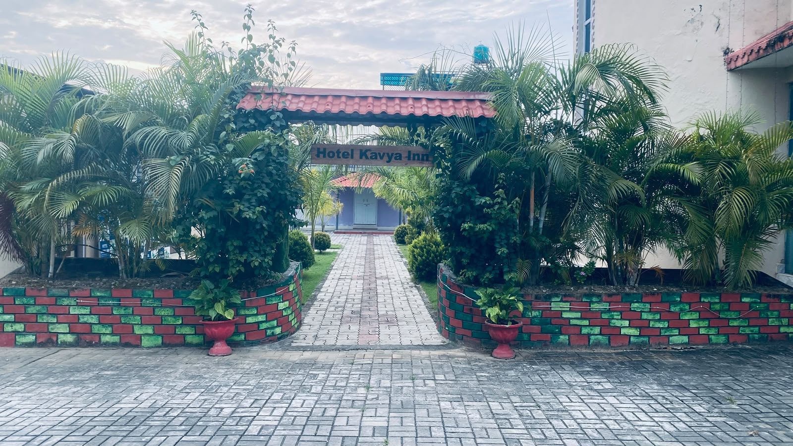 Entrance archway at Hotel Kavya Inn decorated for events