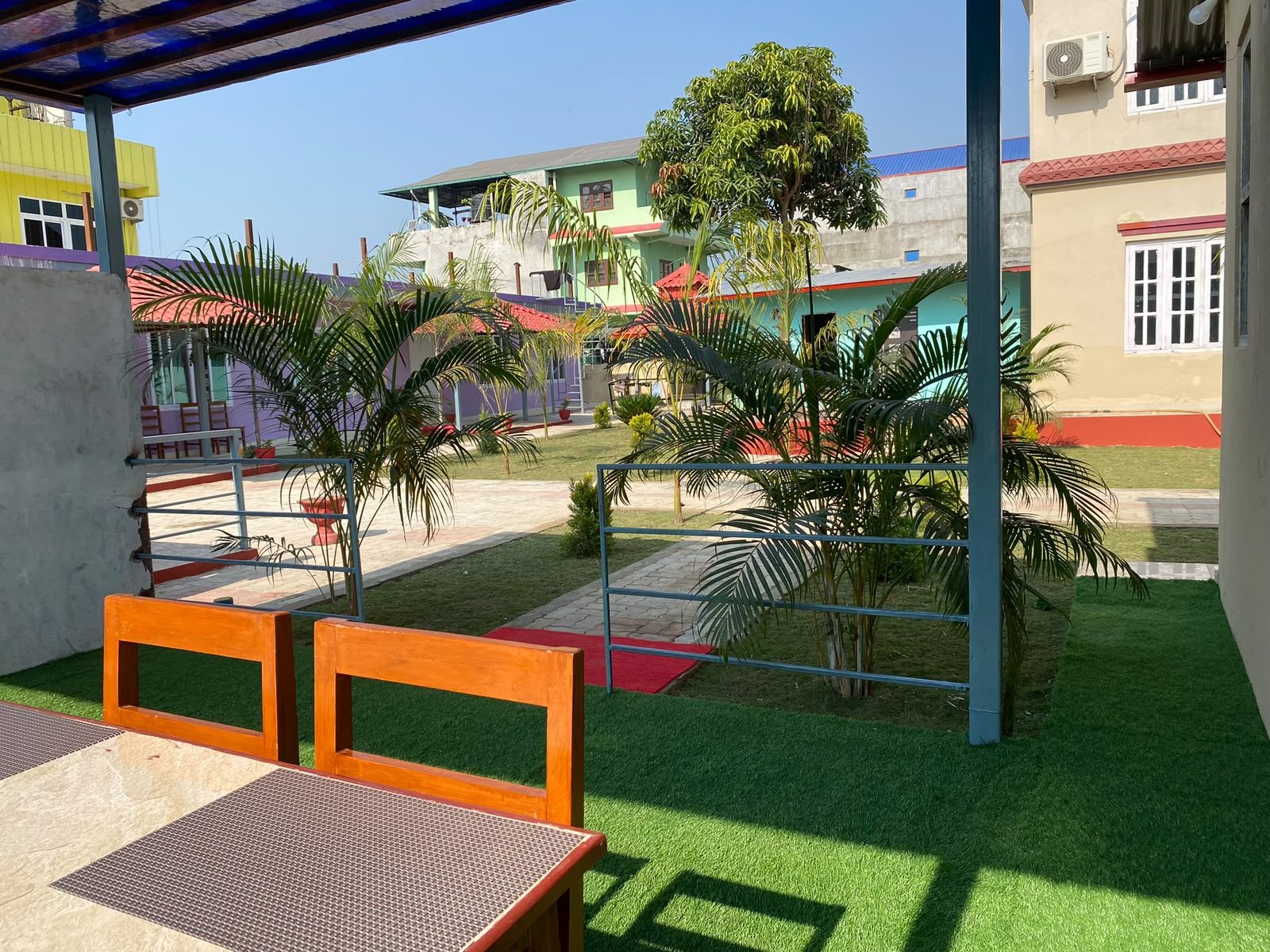 Garden seating area at Hotel Kavya Inn restaurant